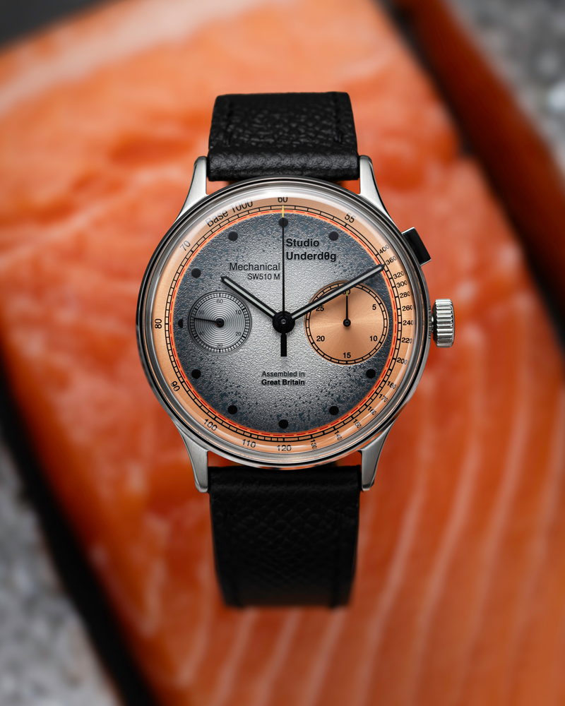 Salm0n’s contrasting dial photographed with its namesake colour inspiration.